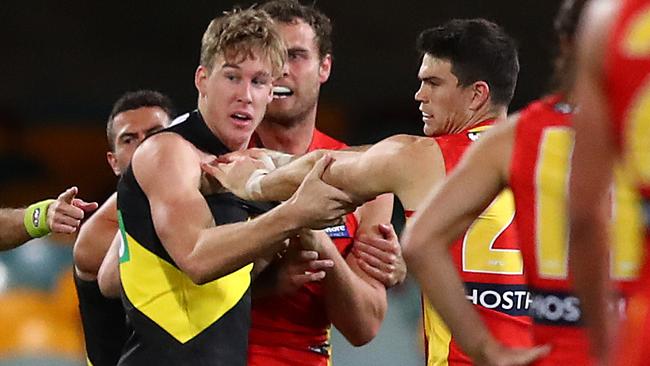 Richmond forward Tom Lynch scuffles with Gold Coast’s Sam Collins. Picture: Getty Images