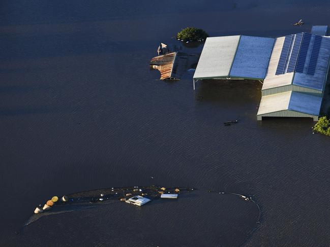 Submerged houses are seen from a helicopter in flood affected areas in the Windsor and Pitt Town areas along the Hawkesbury River near Sydney. Picture: AAP