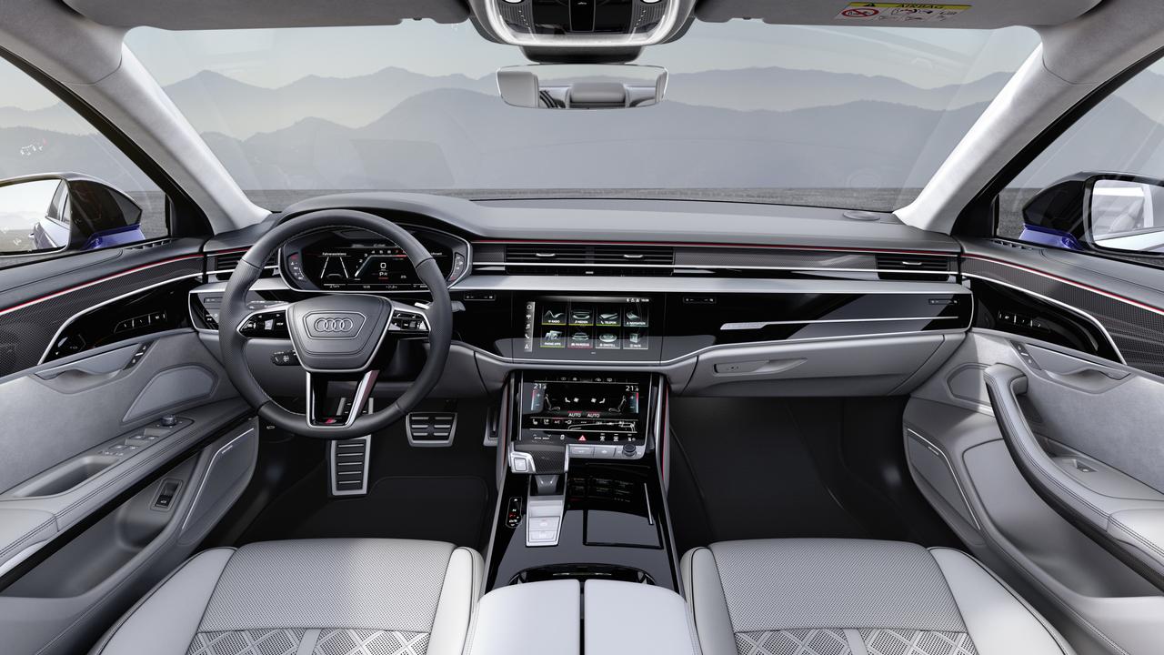 The Audi A8 has a sophisticated cabin with multiple display screens.