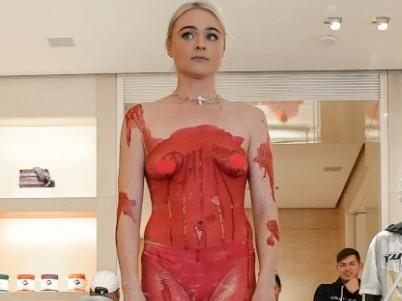 Vegan activist Tash Peterson has covered herself in 'blood' at a Louis Vuitton store once again. Picture: Facebook / Tash Peterson