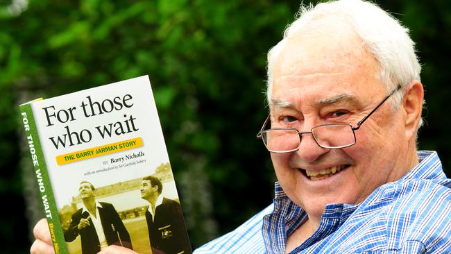 Former Test cricketer Barry Jarman in 2011 with a copy of the the first book written about his Test cricket career by former South Aussie teacher/author Barry Nicholls.