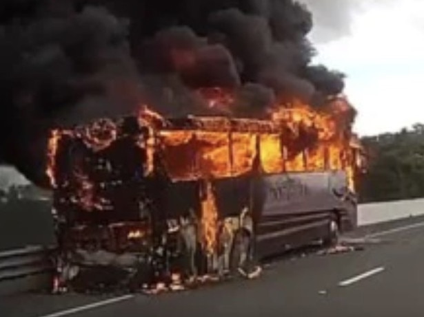 A woman was taken to Gympie Hospital after the coach she and 22 other golfers were travelling on burst into flames on the Bruce Highway near Kybong on Tuesday morning.