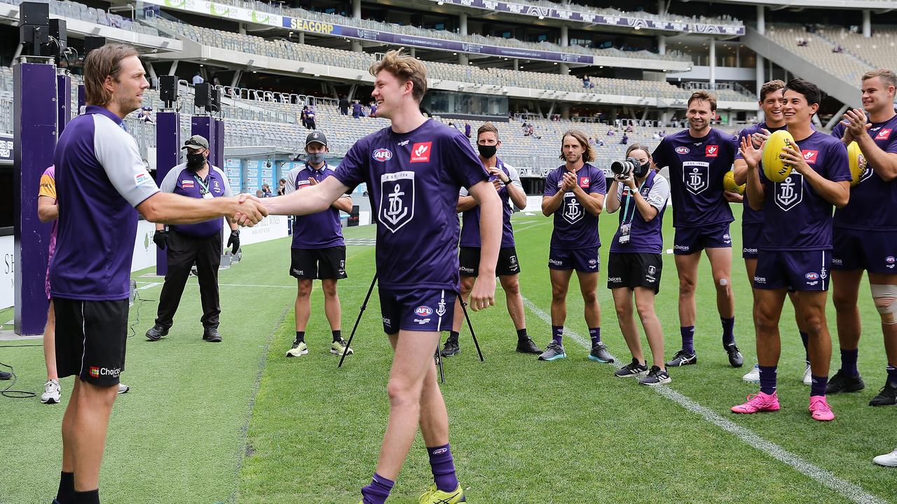 Debutant Nathan O'Driscoll of the Dockers is presented with his shirt. Photo by Will Russell/AFL Photos via Getty Images