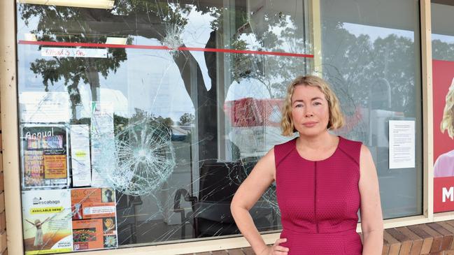 State Labor MP for Pumicestone Ali King with the window of her electorate office which was allegedly vandalised by an anti-vaxxer. Photo: supplied