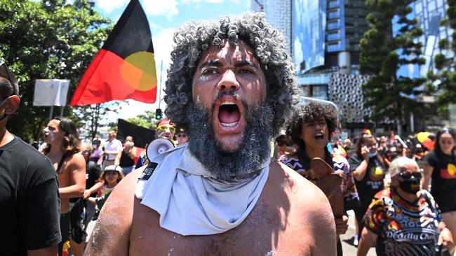 Protesters take part in an Invasion Day march through central Brisbane. Picture: NCA NewsWire / Dan Peled