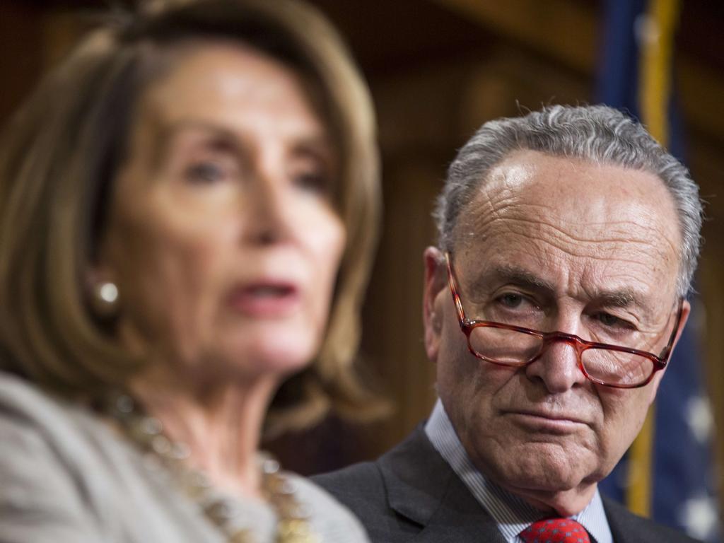 Senate Minority Leader Chuck Schumer listens as House Speaker Nancy Pelosi speaks during a news conference following an announced end to the partial government shutdown. Picture: Zach Gibson/Getty/AFP