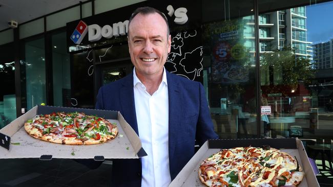 Domino's CEO Don Meij with pizzas at one of his Domino's stores. Photo: Annette Dew