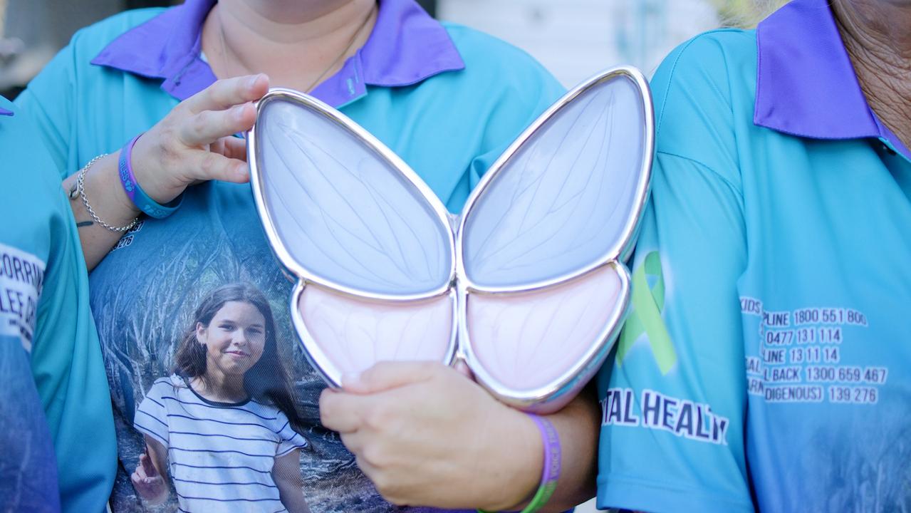 Mother Jodie Fitzgerald standing with ‘nanny’ Patricia Stewart holding, while holding her daughter's ashes inside a pink and purple butterfly urn. Picture: DTTV Still