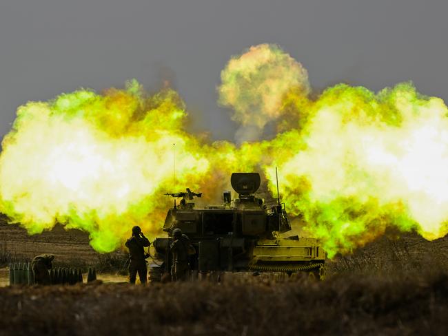 NETIVOT, ISRAEL - OCTOBER 11: An IDF Artillery solider covers his ears as a shell is fired towards Gaza on October 11, 2023 near Netivot, Israel. Israel has sealed off Gaza and conducted airstrikes on Palestinian territory after an attack by Hamas killed hundreds and took more than 100 hostages. On October 7, the Palestinian militant group Hamas launched a surprise attack on Israel from Gaza by land, sea, and air, killing over 700 people and wounding more than 2000. Israeli soldiers and civilians have also been taken hostage by Hamas and moved into Gaza. The attack prompted a declaration of war by Israeli Prime Minister Benjamin Netanyahu. (Photo by Alexi J. Rosenfeld/Getty Images)