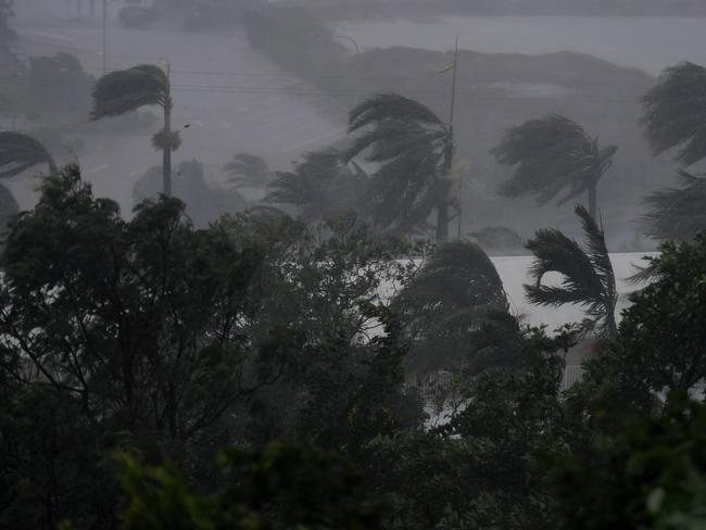 Strong winds and rain lash Airlie Beach yesterday ahead of the storm making landfall. Picture: Dan Peled/AAP