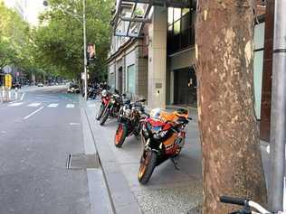 Footpath motorcycle parking already exists in city areas. Picture: Contributed