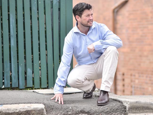 Deputy Mayor Ben Collins is critical of the potholes in Gladesville. Picture: Flavio Brancaleone