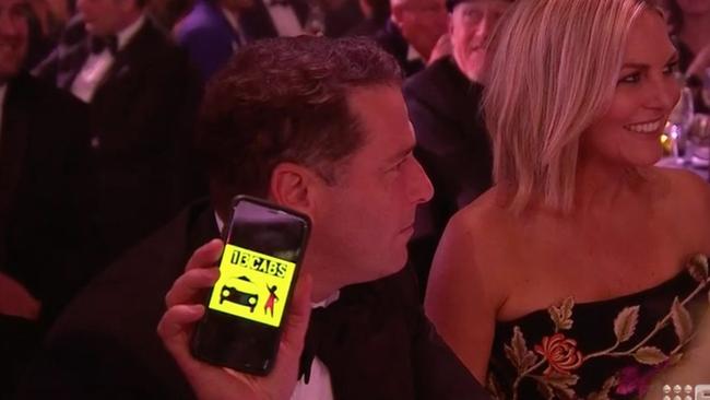 Karl played along with the joke, showing he was already booking a cab. Picture: Channel 9