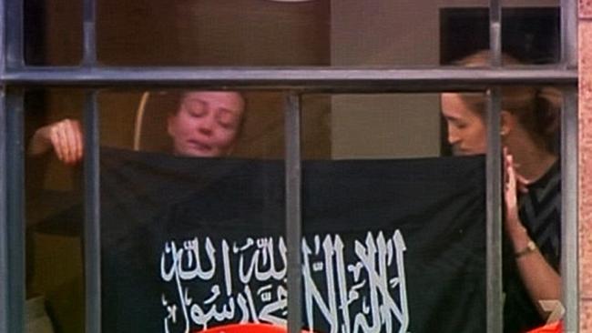 Hostages Marcia Mikhael and Katrina Dawson were forced by Lindt Cafe siege gunman to hold an IS flag to the window during the 2014 ordeal.