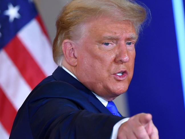 (FILES) In this file photo taken on November 04, 2020 US President Donald Trump gestures after speaking during election night in the East Room of the White House in Washington, DC. - US President Donald Trump has confirmed he will address a rally of his supporters January 6, 2021 in Washington, called in protest at the certification by Congress of the 2020 election results. "I will be speaking at the SAVE AMERICA RALLY tomorrow on the Ellipse at 11AM Eastern (1600 GMT)," tweeted the Republican, who refuses to concede defeat to President-elect Joe Biden. (Photo by MANDEL NGAN / AFP)