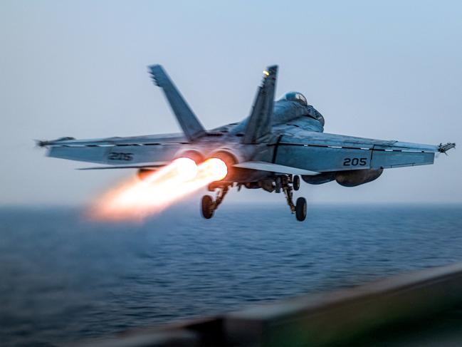 A US F/A-18 Super Hornet attack fighter jet taking off from the US Navy's Nimitz-class USS Harry S. Truman aircraft carrier at sea. Picture: AFP