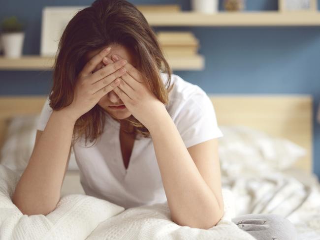 Unhappy girl in a bedroom - Stock image ipad generic