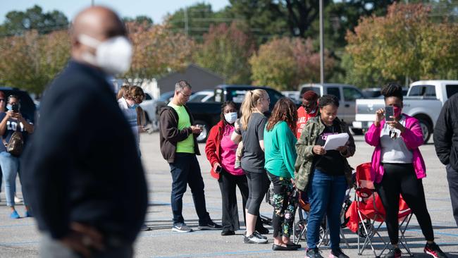 Senate candidate Jaime Harrison looks at a long line of voters in Effingham, South Carolina. Picture: AFP