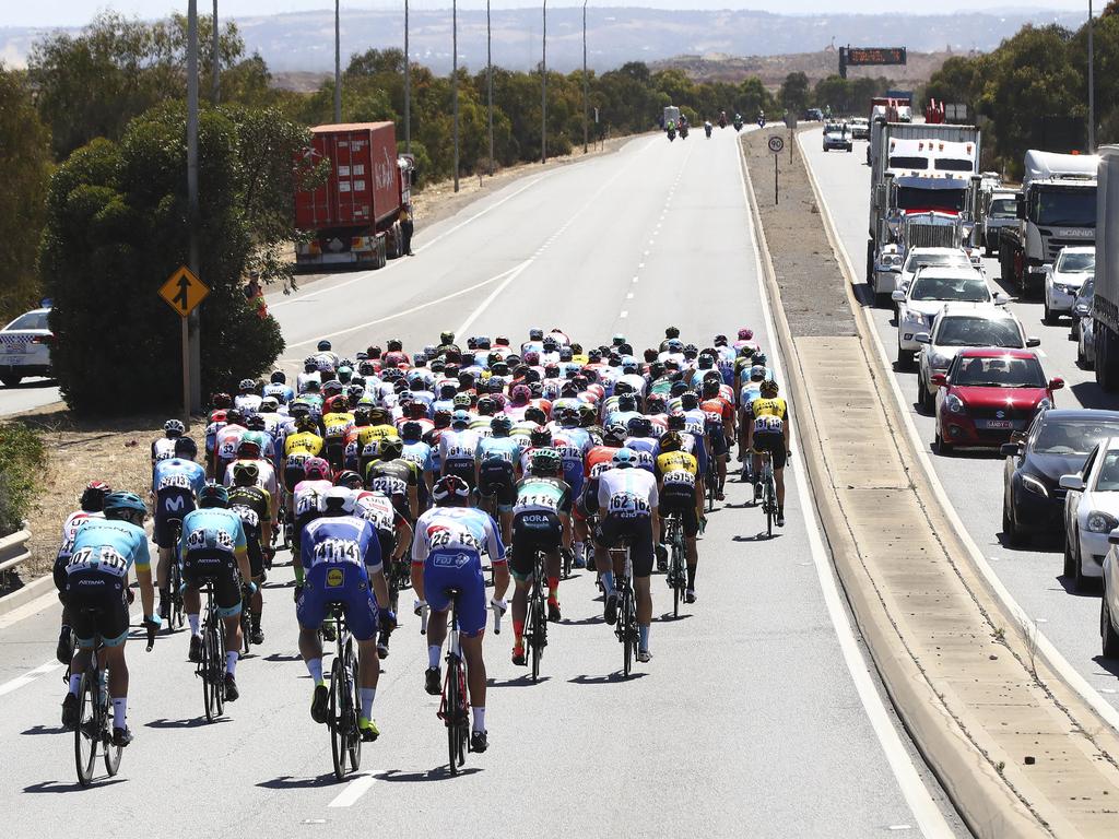 The peloton travels along the Port River Expressway. Picture Sarah Reed