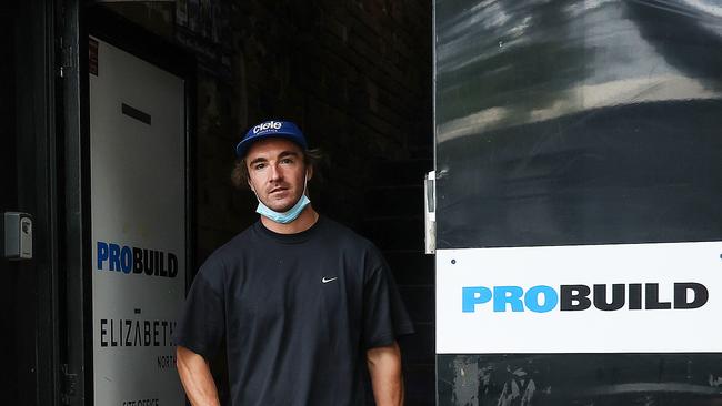 A worker leaves a meeting in the Probuild office site in Melbourne. Picture: Ian Currie.