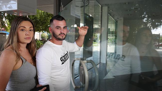 The Cairns Regional Council is looking at ways to convert empty commercial retail space in the city centre into residential zones. Bonnie Campbell and Zak Castini from Brinsmead look into an empty shop on Shields St. PICTURE: BRENDAN RADKE