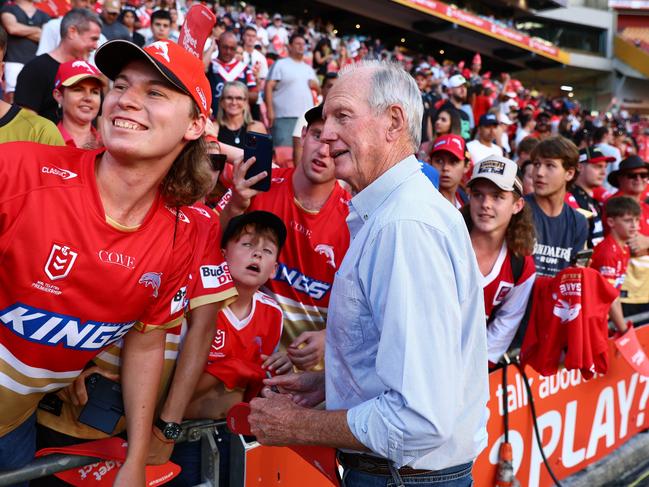 BRISBANE, AUSTRALIA - MARCH 05: Dolphins coach Wayne Bennett with fans after the round one NRL match between the Dolphins and Sydney Roosters at Suncorp Stadium on March 05, 2023 in Brisbane, Australia. (Photo by Chris Hyde/Getty Images)