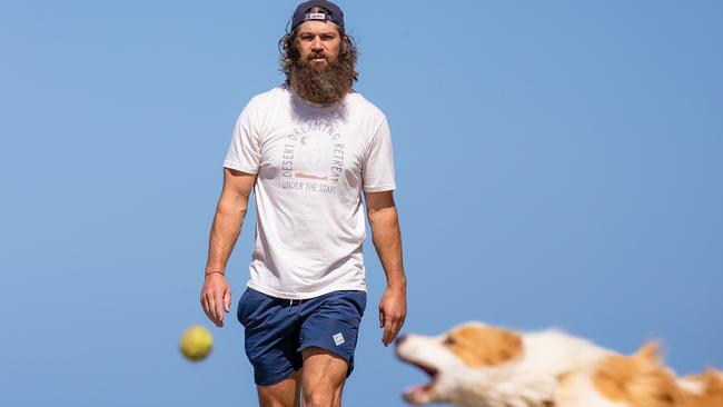 Max Rooke, with his dog Boy, is the lead plaintiff of a class action lodged against the AFL for life altering injuries as a result of concussion Picture: Jason Edwards