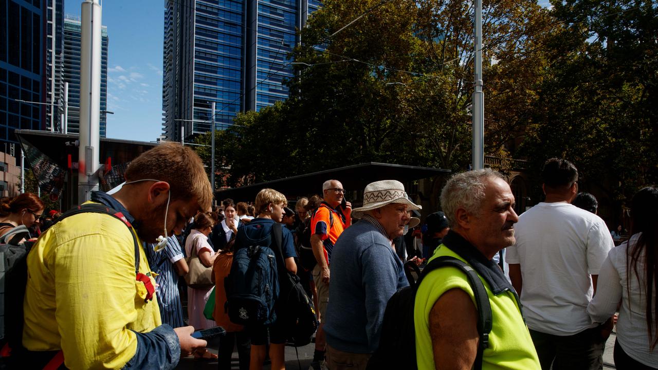 SYDNEY, AUSTRALIA – NewsWire Photos MARCH 8, 2022: People leave Town Hall Station and wait for light rail in Sydney after the rail network closed on Wednesday afternoon. Picture: NCA NewsWire / Nikki Short