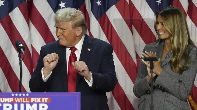 Republican presidential nominee and former president Donald Trump dances as former first lady Melania Trump watches at the Palm Beach County Convention Center during an election night watch party. Picture: AP