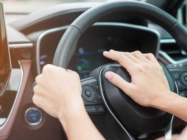 woman driver honking a car during driving on traffic road, hand controlling steering wheel in vehicle. Journey, trip and safety Transportation concepts  Picture: istock