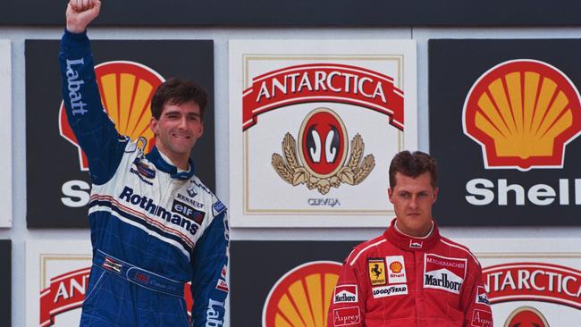 Damon Hill and Michael Schumacher after the Englishman’s win in the 1996 Brazilian Grand Prix. Picture: Getty Images