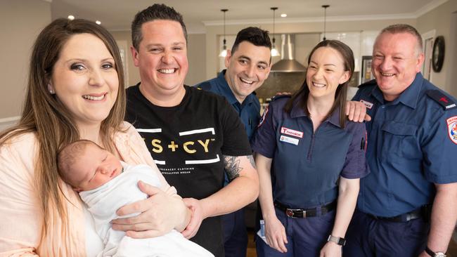 Sarah and Matthew Spinner and baby Brooklyn with paramedics Michael Georgiou, Kate Mooney, and Sebastian Kalinowski. Picture: Jason Edwards