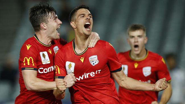 Adelaide’s George Blackwood celebrates scoring a second half goal against Central Coast Mariners in Gosford
