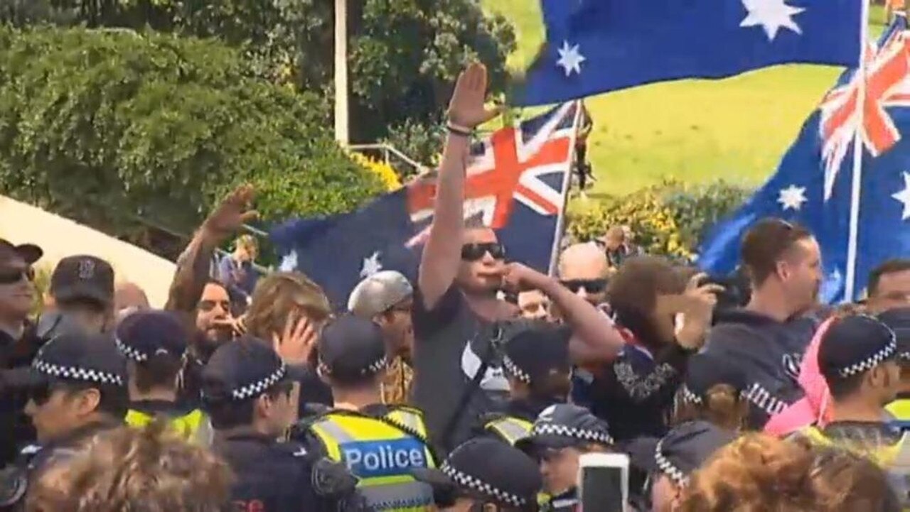 A far right extremist throws his arm up in a Nazi salute at St Kilda. Picture: ABC News