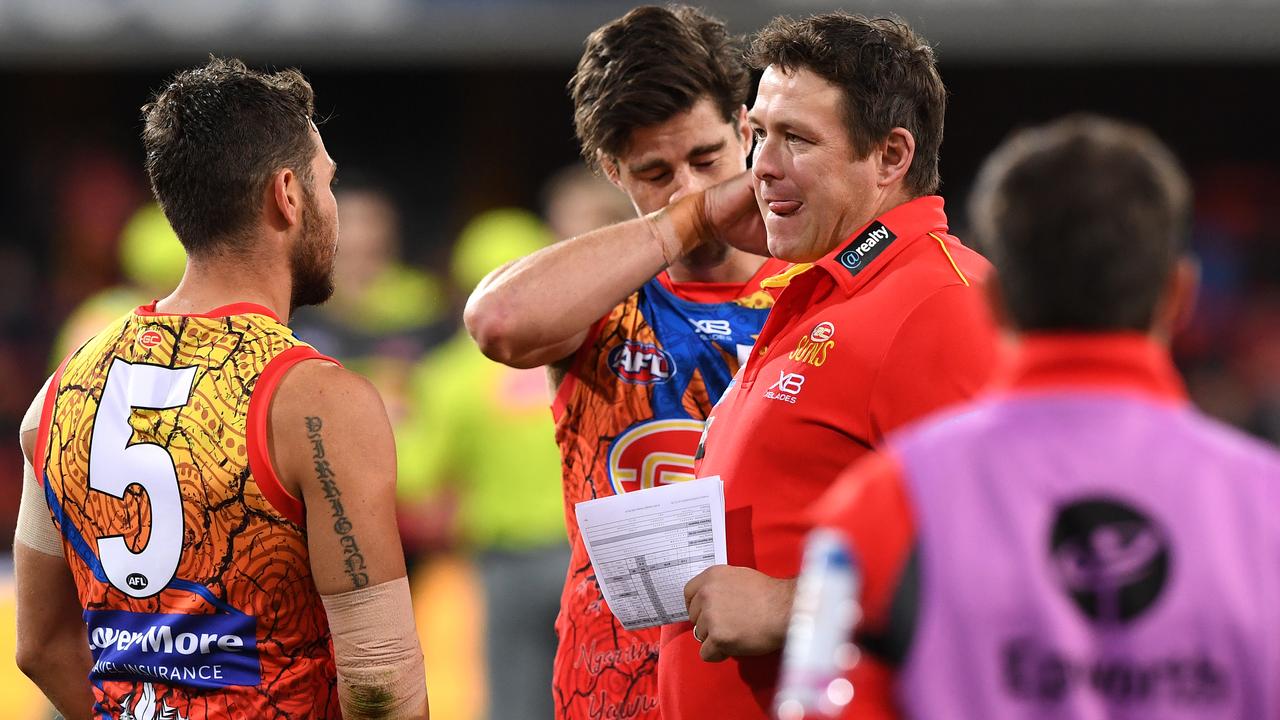 Gold Coast coach Stuart Dew reacts during Saturday night’s loss to Adelaide.