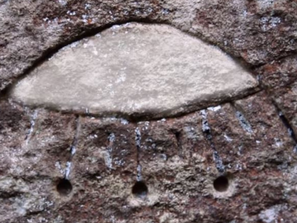 Aliens! Really? This shape scratched out of the sandstone face of a Gosford rock formation is being interpreted as representing an ancient flying saucer. Picture: History Channel