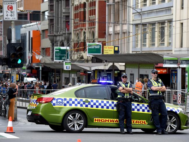 Victoria Police blocked off Flinders Street to traffic and pedestrians. Picture: Kylie Else