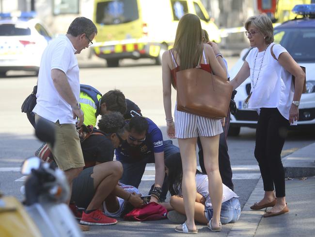 An injured person is treated in Barcelona, Spain. Picture: AP Photo/Oriol Duran