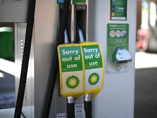 Out of use signs are attached to pumps at a BP petrol station in London due to a lack of lorry drivers to deliver fuel. Picture: AFP