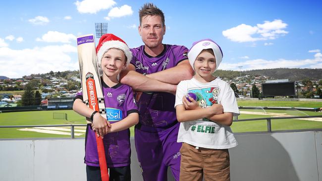 Hurricanes’ James Faulkner with young fans Oliver Meers, 6 (left) and Jack Lemm, 7 Picture: LUKE BOWDEN