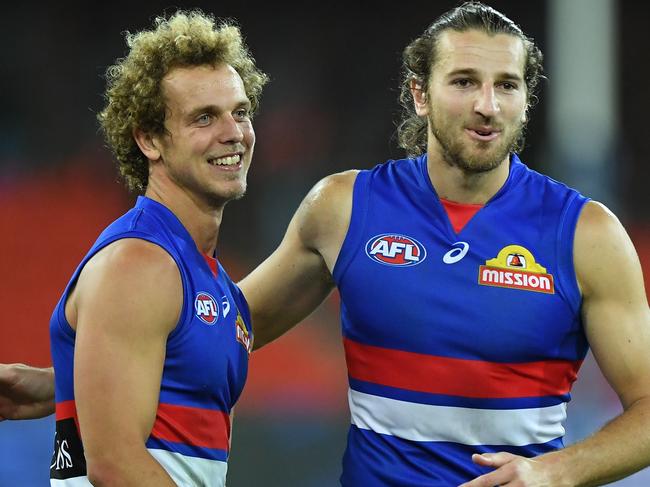 GOLD COAST, AUSTRALIA - SEPTEMBER 06: Marcus Bontempelli of the Bulldogs celebrates victory with Mitch Wallis during the round 16 AFL match between the Western Bulldogs and the West Coast Eagles at Metricon Stadium on September 06, 2020 in Gold Coast, Australia. (Photo by Matt Roberts/AFL Photos/via Getty Images)