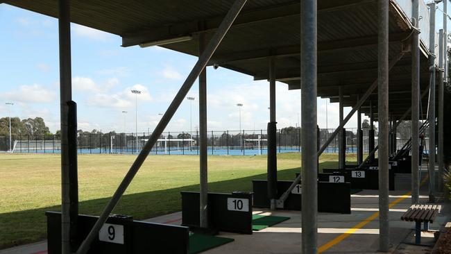The two facilities are so close to each other that golf balls could easily end up on the courts. Picture: Hamish Blair