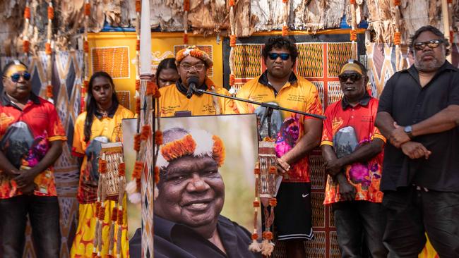 Binmila Yunupingu and Yunupingu’s son, Gabirri Collins-Yunupingu (third from R) and family members speak at the funeral service of Yunupingu in northeast Arnhem Land. Picture: Peter Eve / Yothu Yindi Foundation