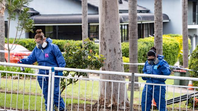 Officers search for clues. Picture: Julian Andrews