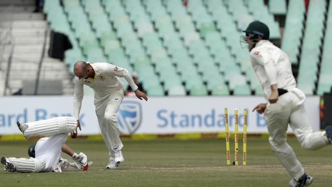 Nathan Lyon drops the ball on AB de Villiers after running him in Durban. Picture: AP.