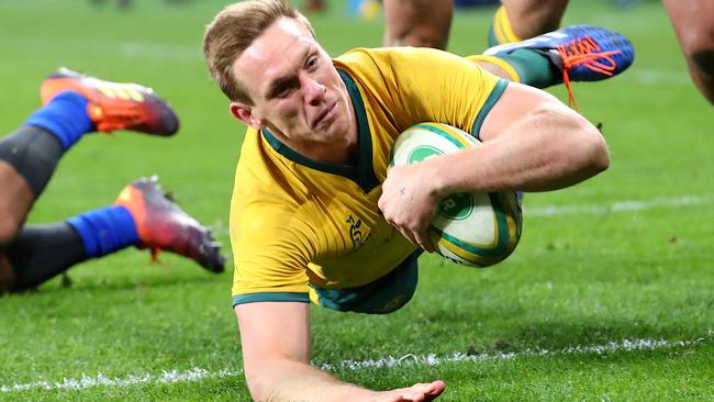 Dane Haylett-Petty of the Wallabies dives to score a try last year