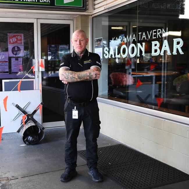 Neptune Security Guard Wayne Reed stands in front of damaged Karama Tavern in 2021. Picture Katrina Bridgeford.