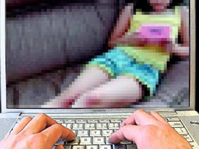 child porn - generic of hands on computer laptop keybord with a photograph of a young child on the screen re: Child sex exploitation. Picture: Supplied