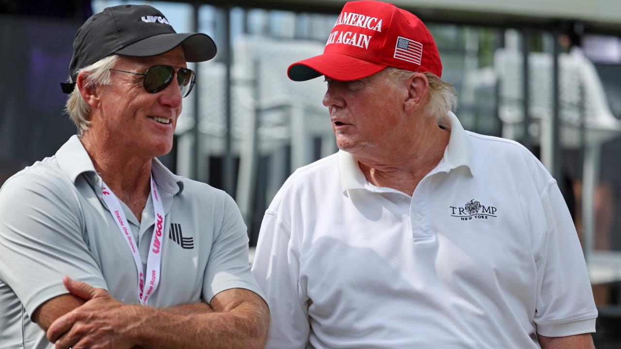 LIV Golf CEO and commissioner Greg Norman talks with former US President Donald Trump on the first tee during the pro-am prior to the LIV Golf Invitational - Bedminster. Picture: Jonathan Ferrey/LIV Golf via Getty Images