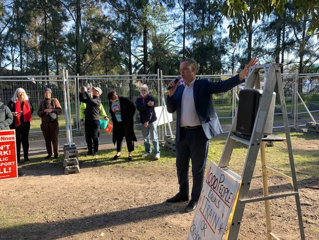 Balmain MP Jamie Parker speaking to protesters in Buruwan Park.